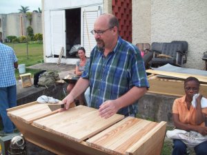 Summer intern Christy can been seen right behind Tom with her laptop, taking a break from surveying workshop participants.